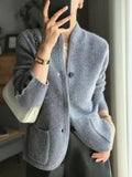 gilet femme boutonné col montant poches en gris