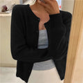gilet femme col rond coupe ample boutonné en noir