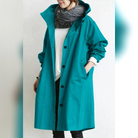 manteau de pluie femme capuche oversize en turquoise