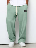 pantalon homme coupe droite large taille élastique en vert
