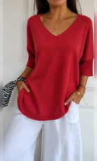 pull femme col en v manches trois-quarts oversize en rouge