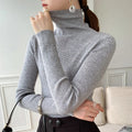 pull femme col roulé coupe slim en gris