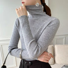 pull femme col roulé coupe slim en gris