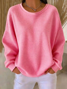 pull femme oversize col rond texturé en rose