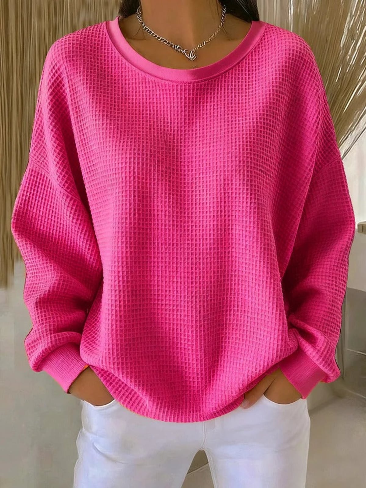 pull femme oversize col rond texturé en rose vif