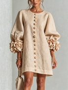 robe femme trapèze manches bouffantes boutons floraux en abricot